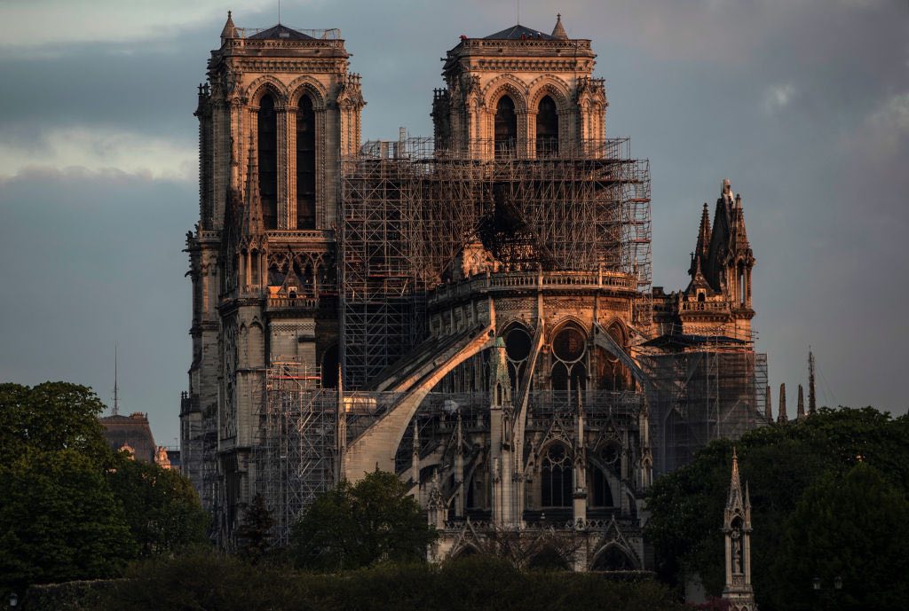 PARIS, FRANCE - APRIL 17: Notre-Dame Cathedral at sunrise following a major fire on Monday on April 17, 2019 in Paris, France. A fire broke out on Monday afternoon and quickly spread across the building, causing the famous spire to collapse. The cause is unknown but officials have said it was possibly linked to ongoing renovation work. (Photo by Dan Kitwood/Getty Images)